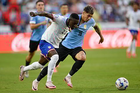 Folarin Balogun and Mathias Olivera battle for the ball